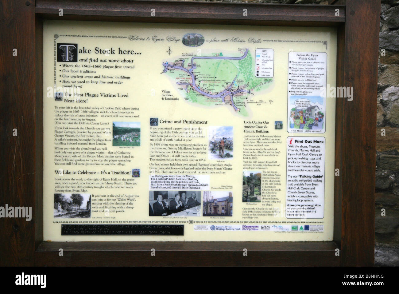 Sign at the stocks Eyam Village the Black death plague village in derbyshire Stock Photo
