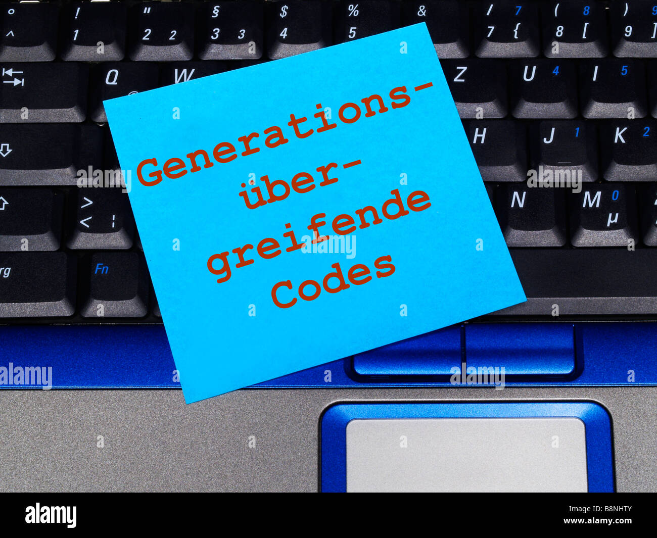 memo note on notebook, generations spanning codes Stock Photo