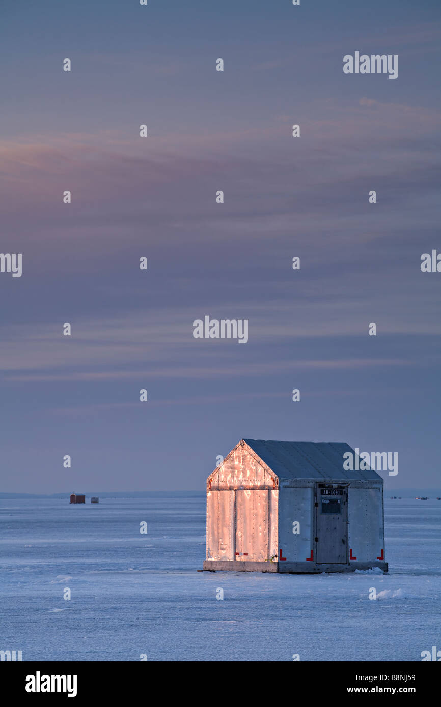 Ice hut at sunrise on a frozen Lake Simcoe in Ontario, Canada Stock Photo