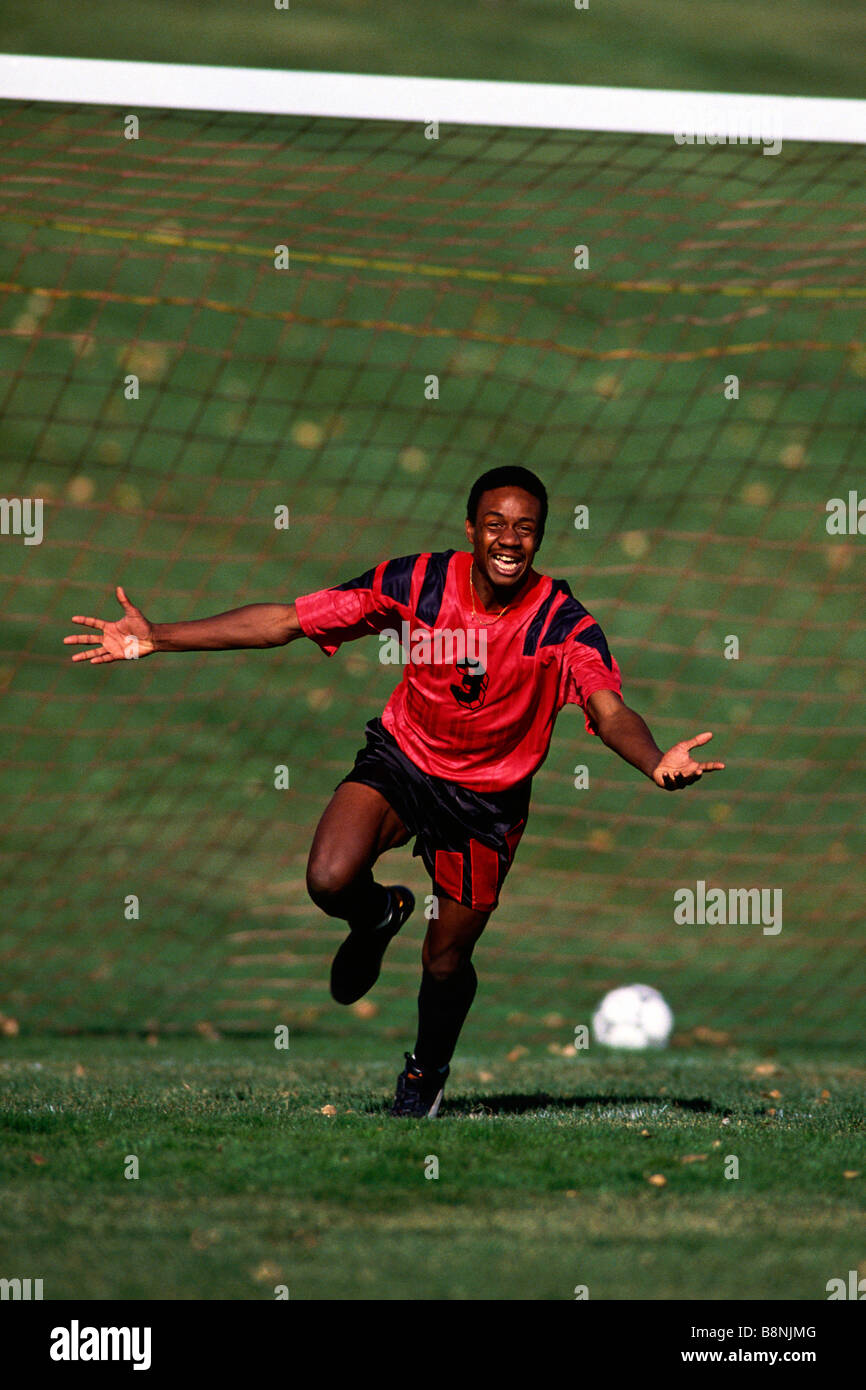 Soccer player celebrating after scoring a goal Stock Photo Alamy