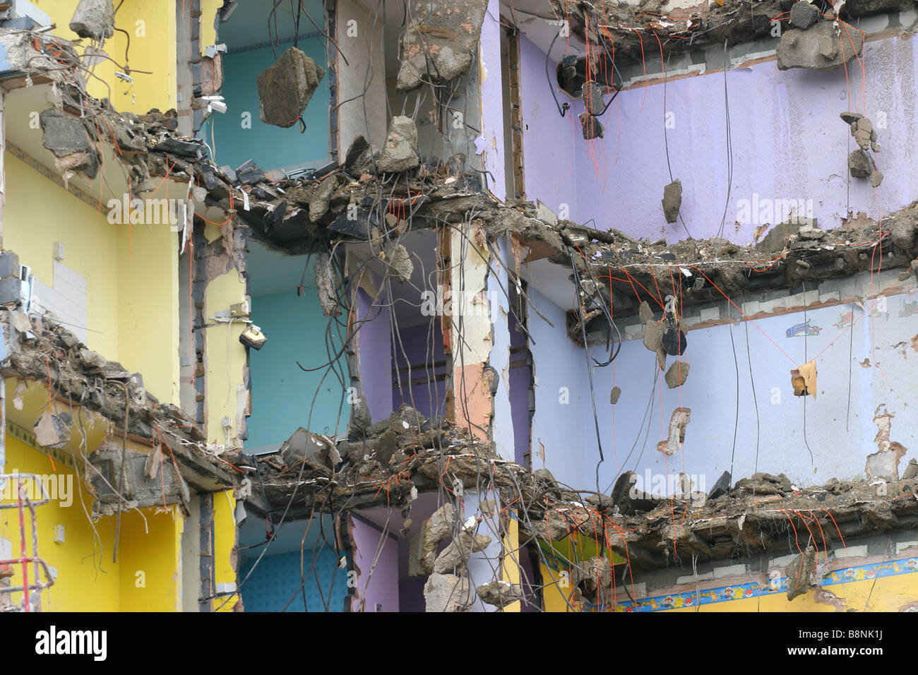 The interiors of flats after their exterior walls have been removed during demolition. Stock Photo