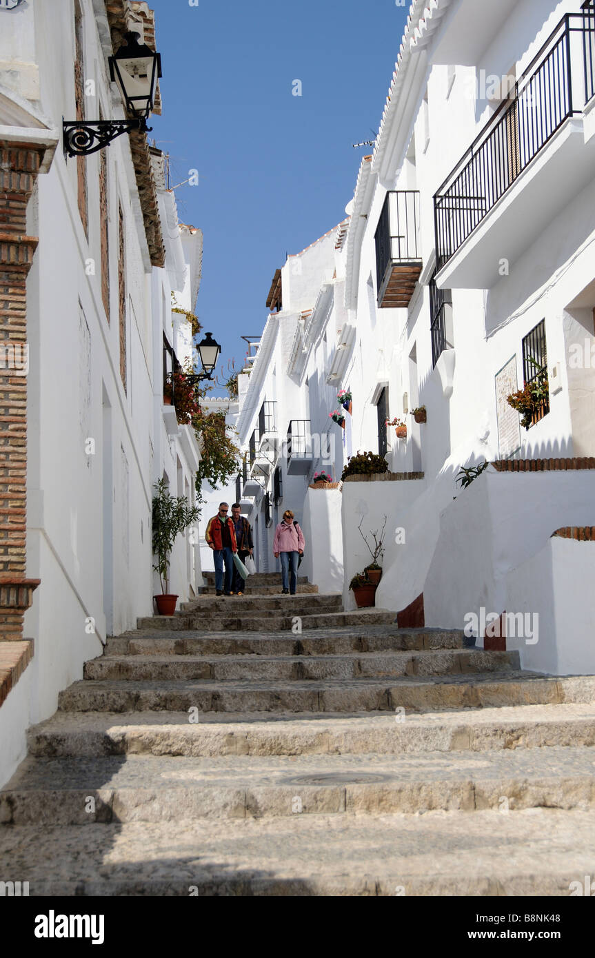 Steep steps on narrow street in the white town of Frigiliana southern Spain popular visitor attraction Stock Photo