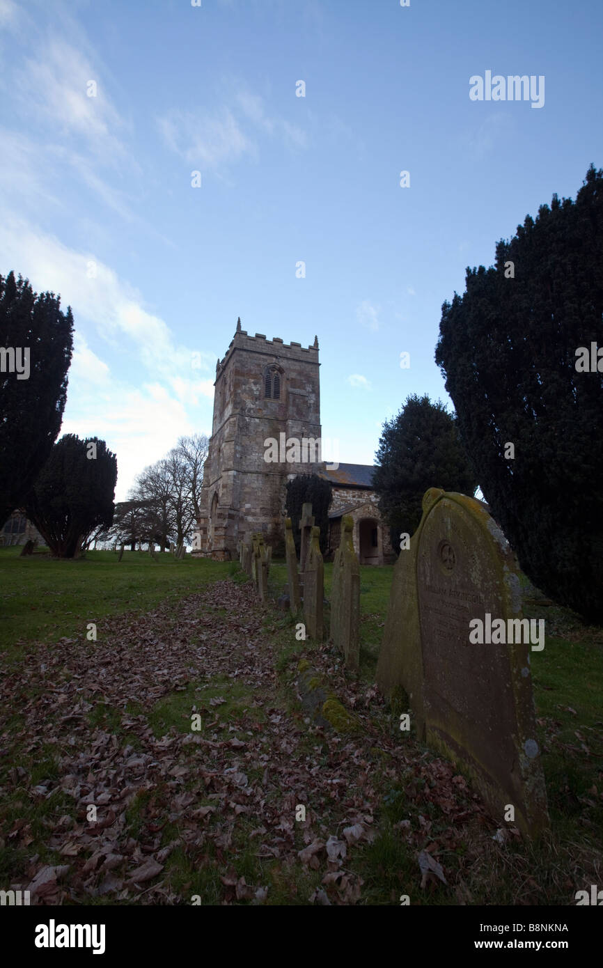 St Adelwold church in Alvingham near Louth, Lincolnshire. A small church used for weddings and burials, note grave stones Stock Photo