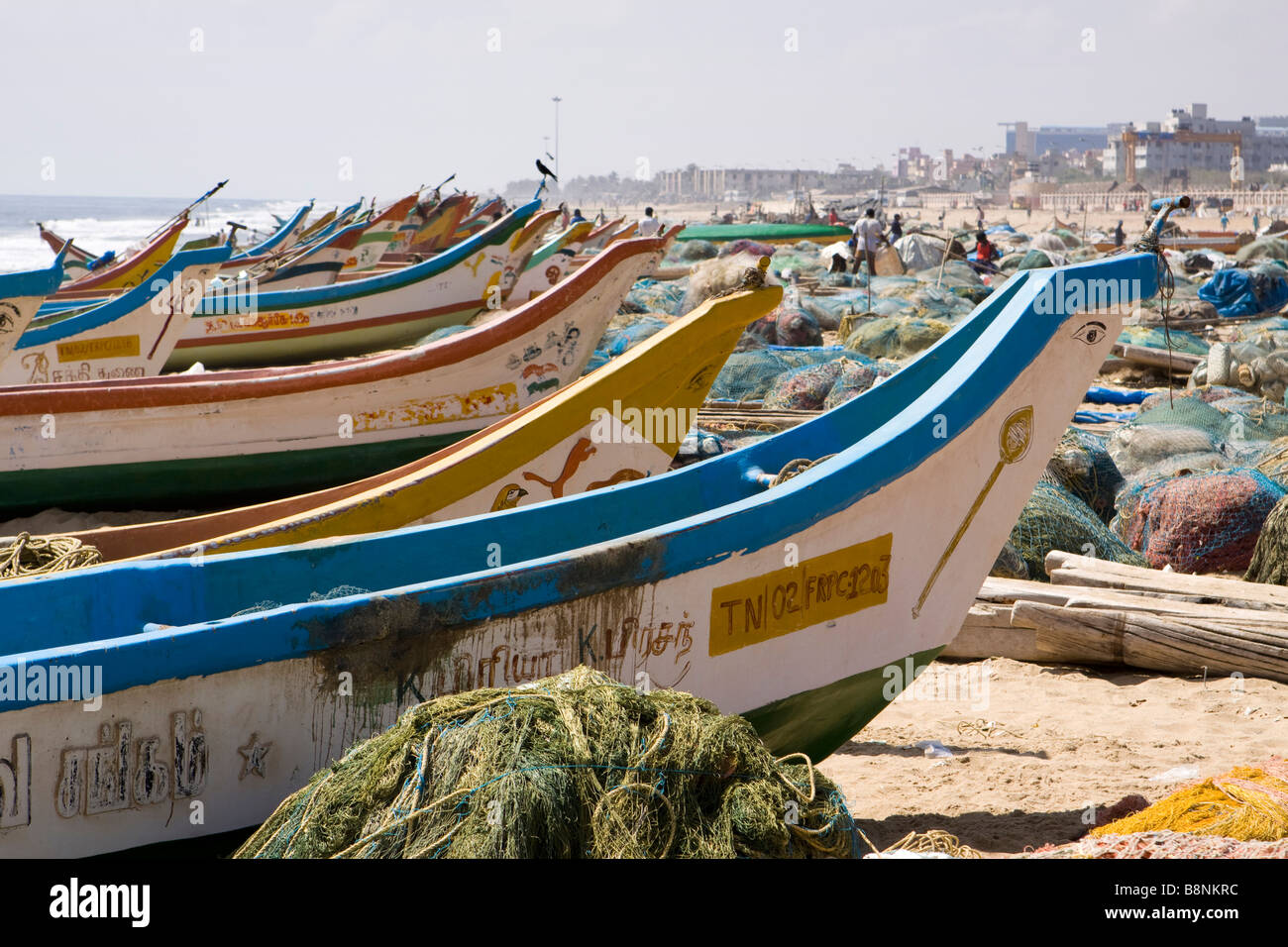 India Tamil Nadu Chennai beach tsunami relief fibreglass fishing boats on shore Stock Photo