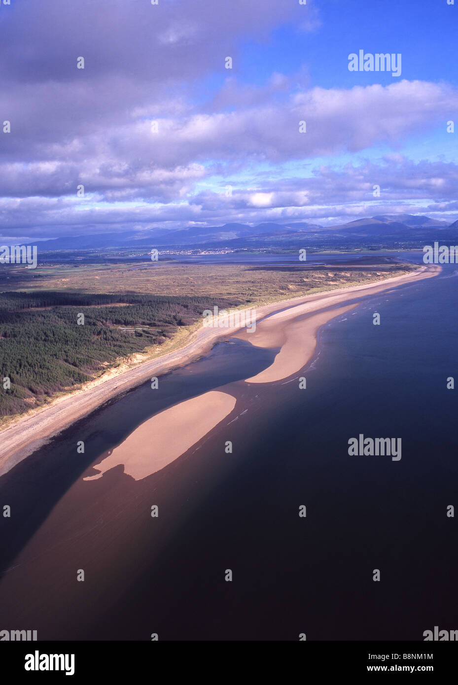 Newborough Warren and beach Aerial view looking towards Menai Strait entrance and Snowdonia  Anglesey North Wales UK Stock Photo