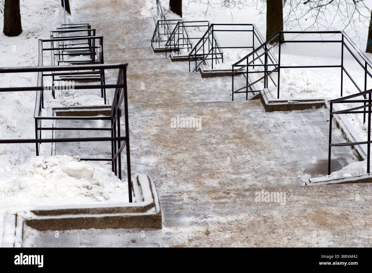Winter stairs covered with sand to improve friction. Stock Photo