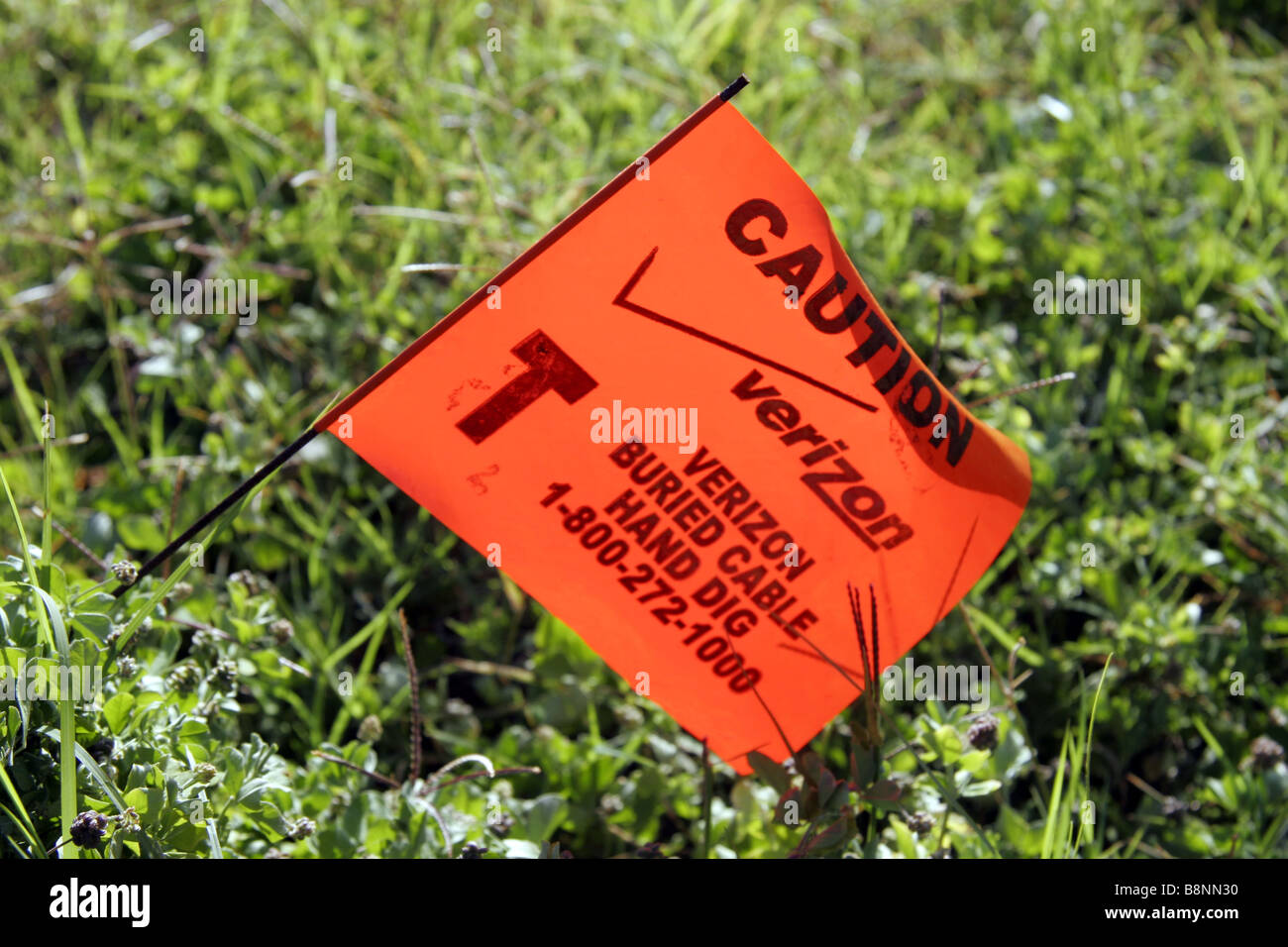 Buried cable warning flag Stock Photo