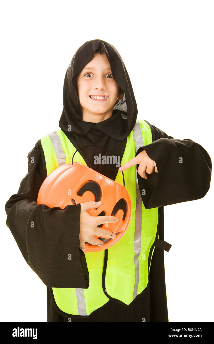 Adorable little boy in his halloween costume wearing a reflective vest