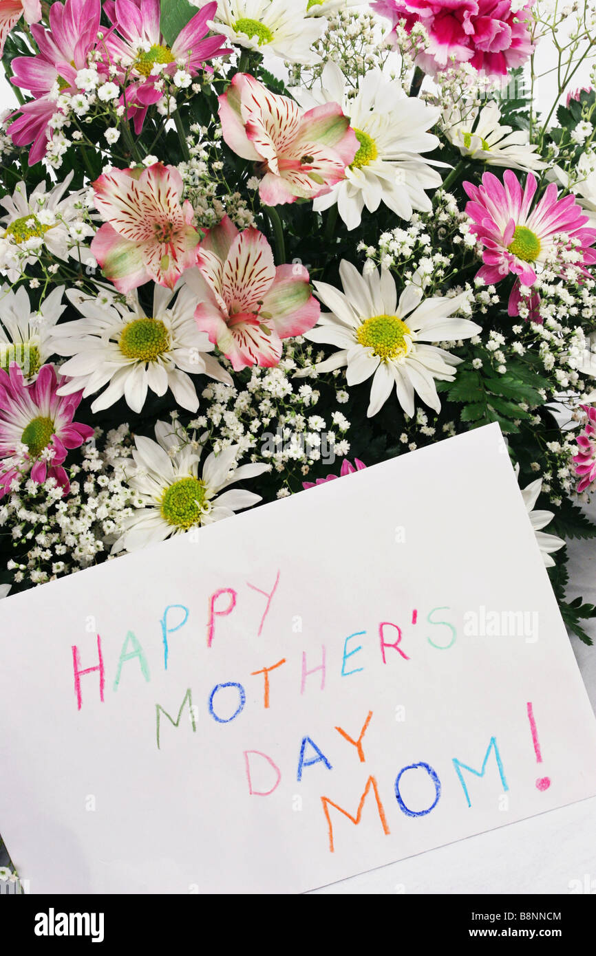 A bouquet of flowers with a card that says Happy Mother s Day Mom ...