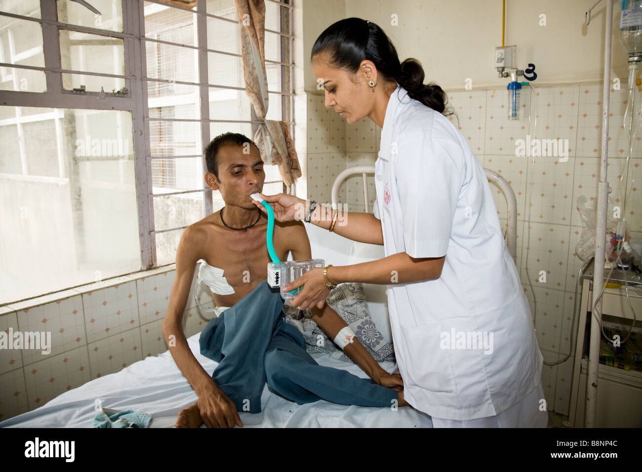 Nurse giving a breathing test to a sick patient on a general ward of