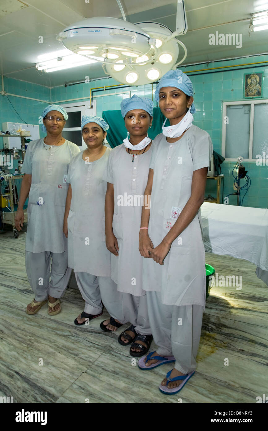 Theatre nurses in an operating theatre of the New Civil Hospital, Surat. Gujarat. Stock Photo