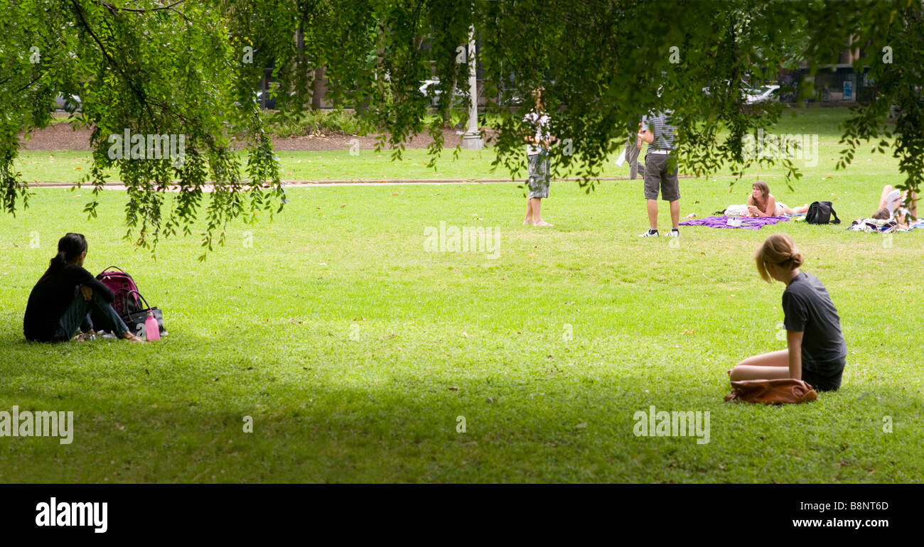 Single women watch men with partners in Hyde Park Stock Photo