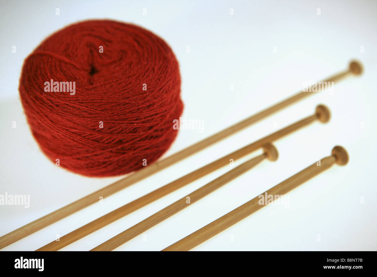 needlework still life - hand knitting tools and wool yarns on wooden table  Stock Photo - Alamy