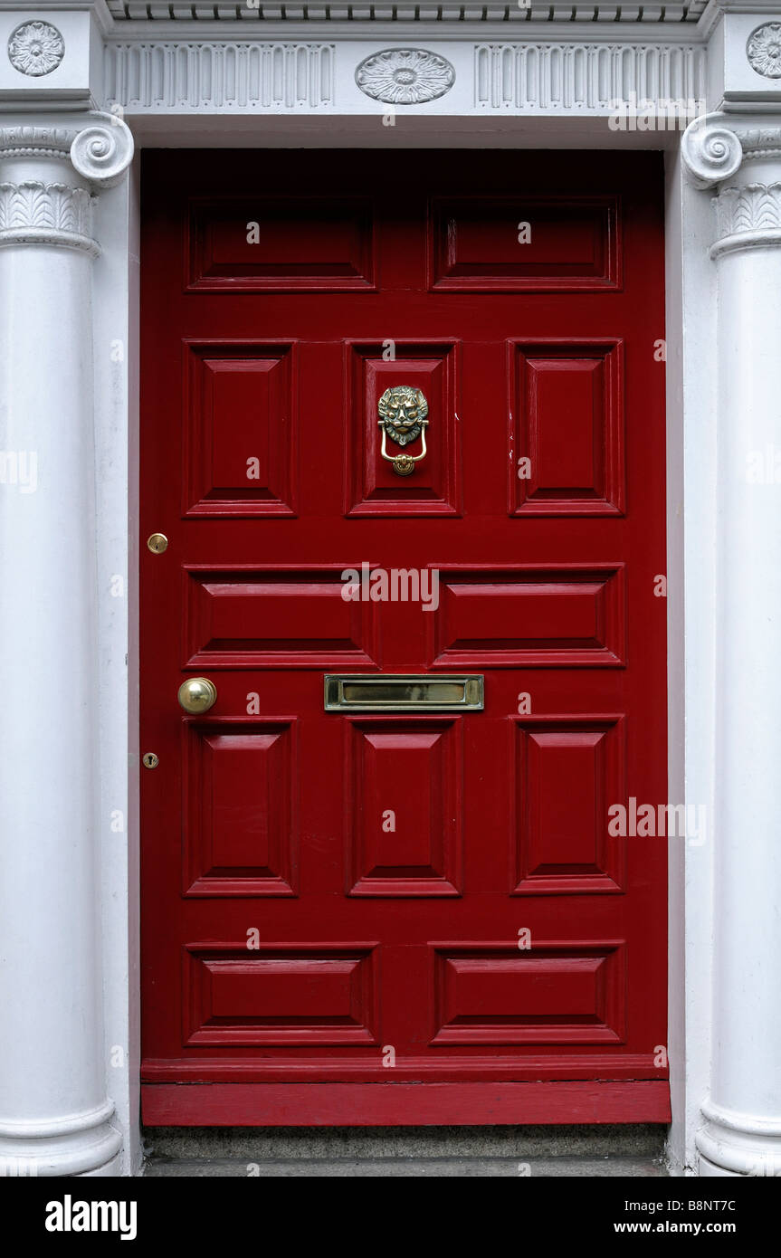 Red painted doorway door arched arch entrance formal style St saint stephens green
