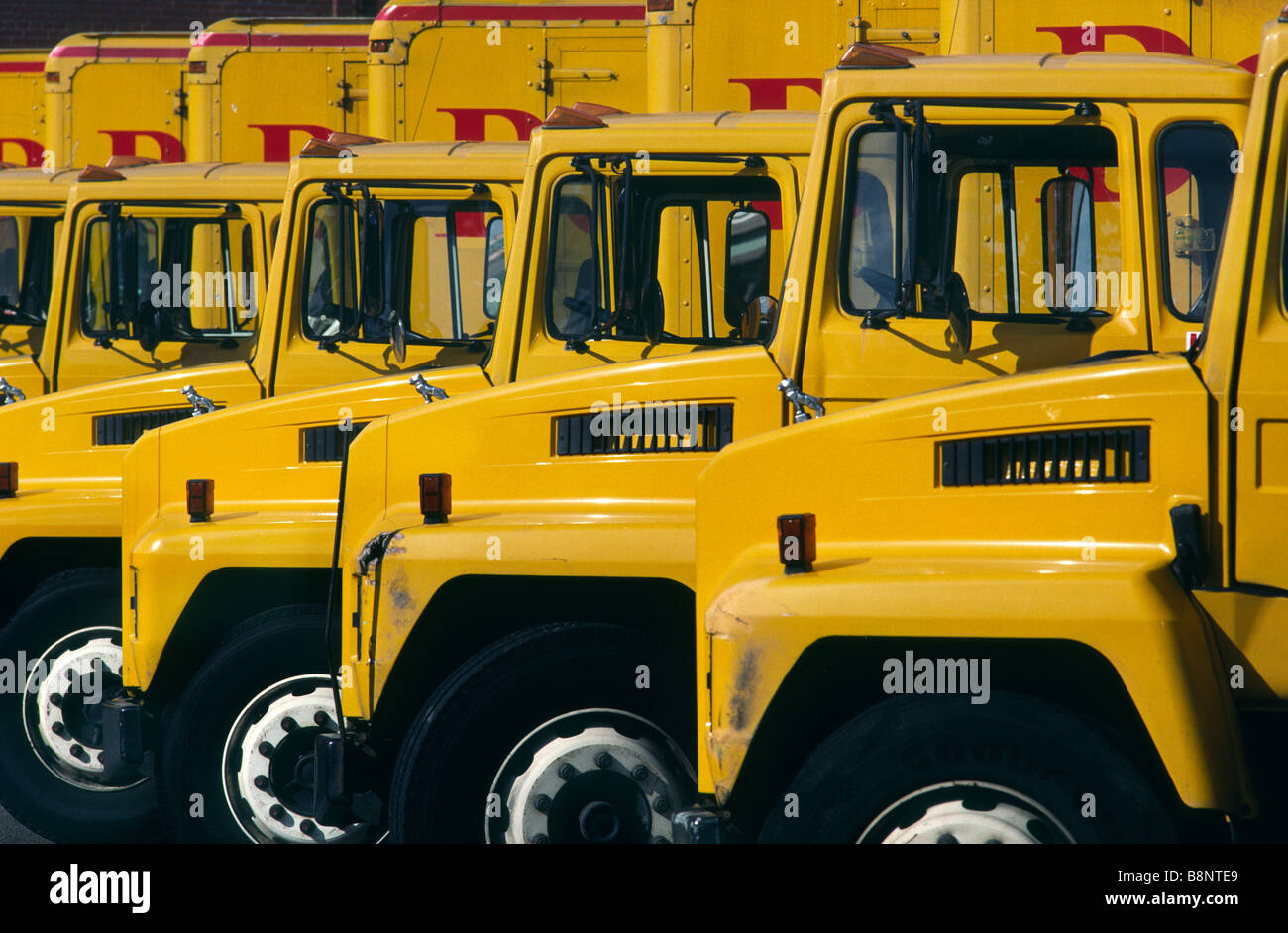 A fleet of yellow delivery trucks Stock Photo