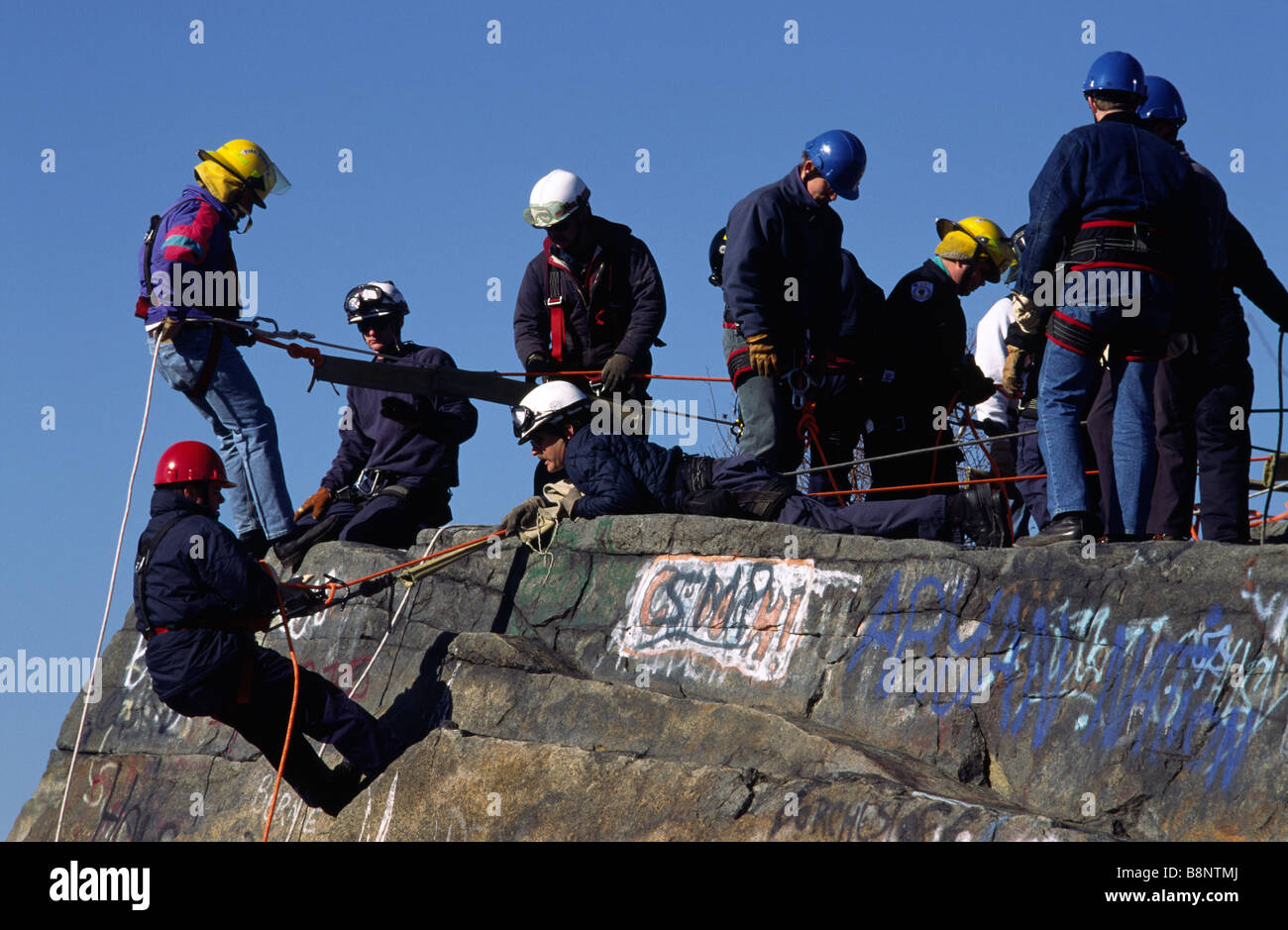 Fire and emergency personnel practice belaying at a rock quarry, Quincy