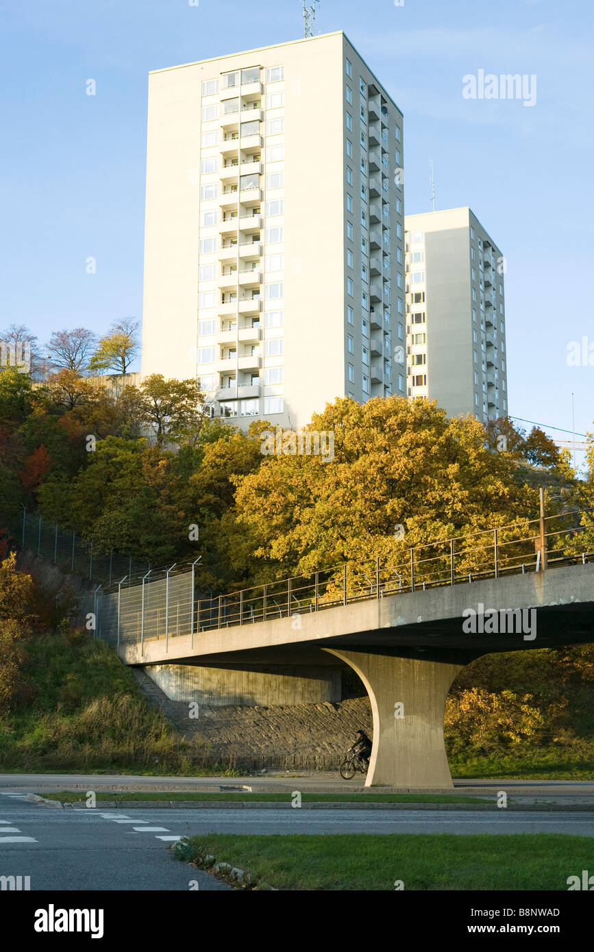 Sweden, Stockholm, pair of high rise buildings behind wooded hill Stock Photo