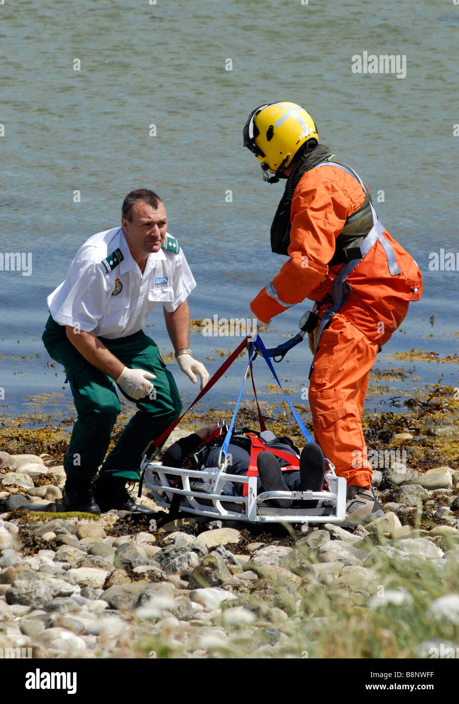 Coastguard winchman with medic and injured person Stock Photo Alamy