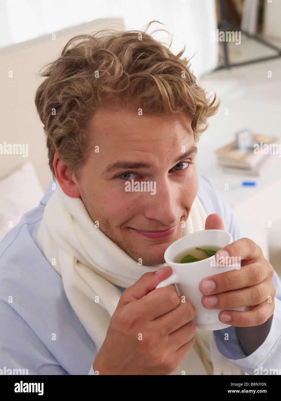 young man sick in bed Stock Photo