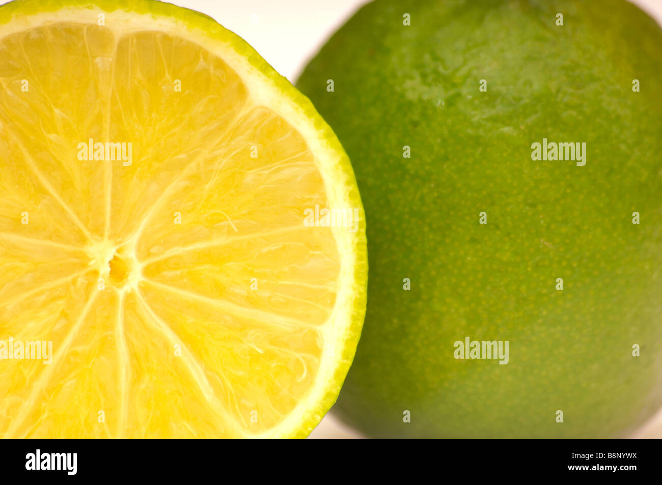 a close up of two limes yellow and green Stock Photo Alamy