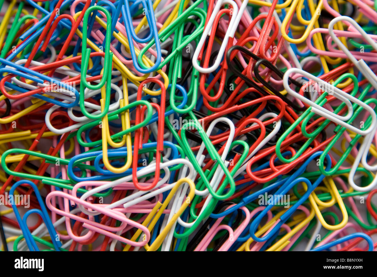 Brightly coloured paper clips Stock Photo