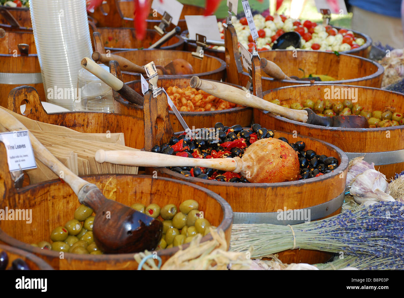 A selection of olives and other food on sale at a farmers maket in Hyde Park, London Stock Photo