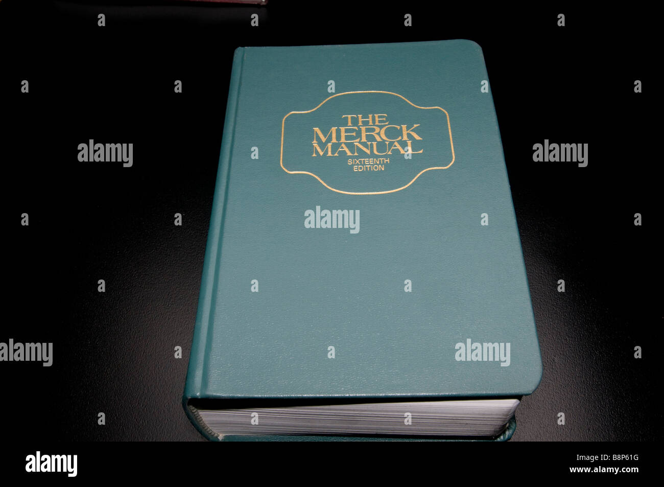 The Merck Manual of Diagnosis and Therapy on black background - Stock Image