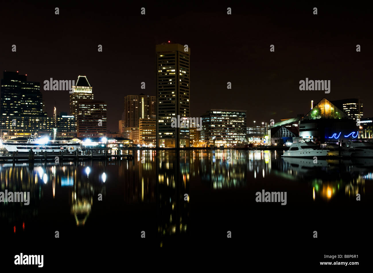 Inner Harbor Reflections in the Chesapeake Bay at night, Baltimore Maryland Stock Photo
