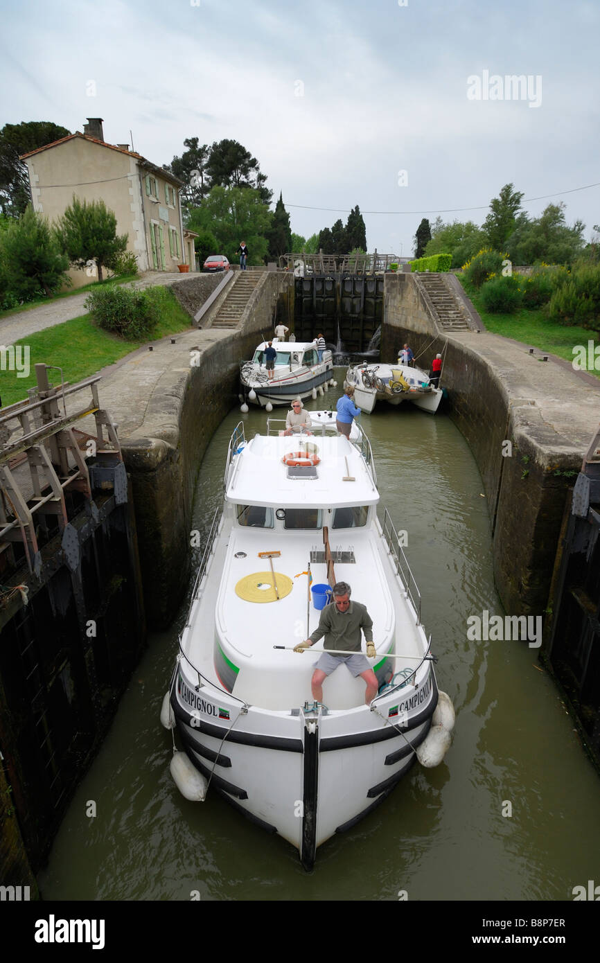 Carcassonne France Barge traverses the Ecluse de Fresquel just outside of Carcassonne on the Canal du Midi Stock Photo