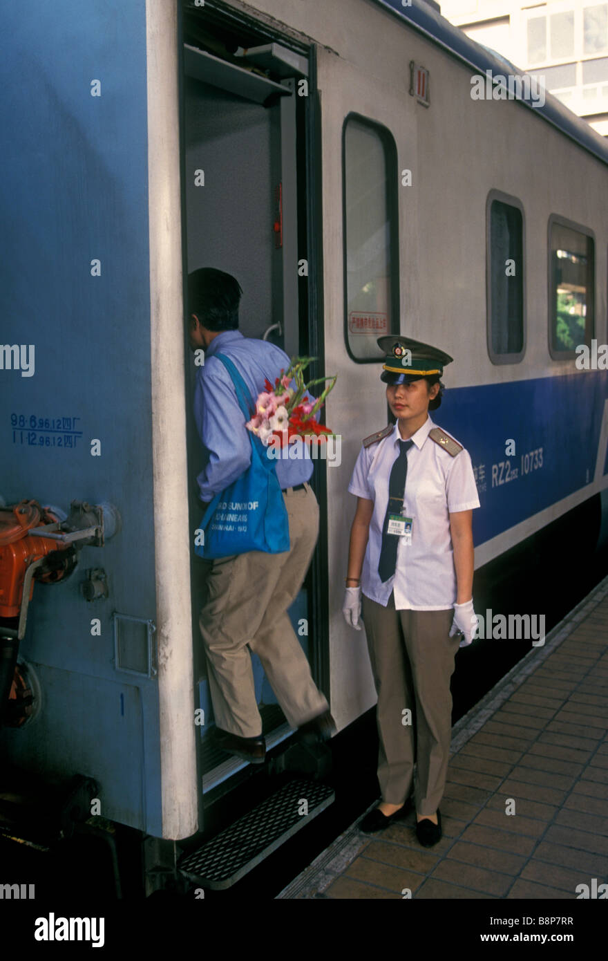 Chinese woman, train attendant, worker, employee, hostess, railway station, railroad station, train station, Shanghai, Shanghai Municipality, China Stock Photo