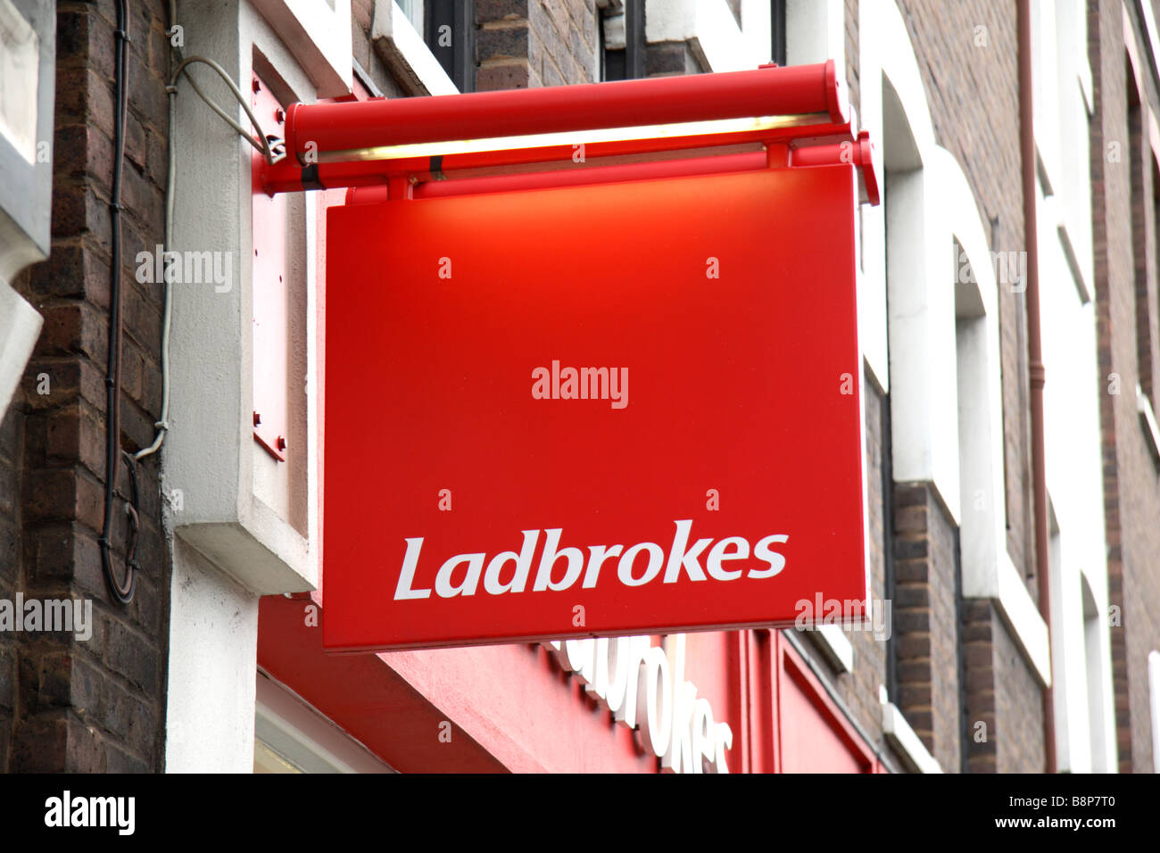 A sign above the Ladbrokes betting shop on Long Lane, London. Feb 2009 Stock Photo