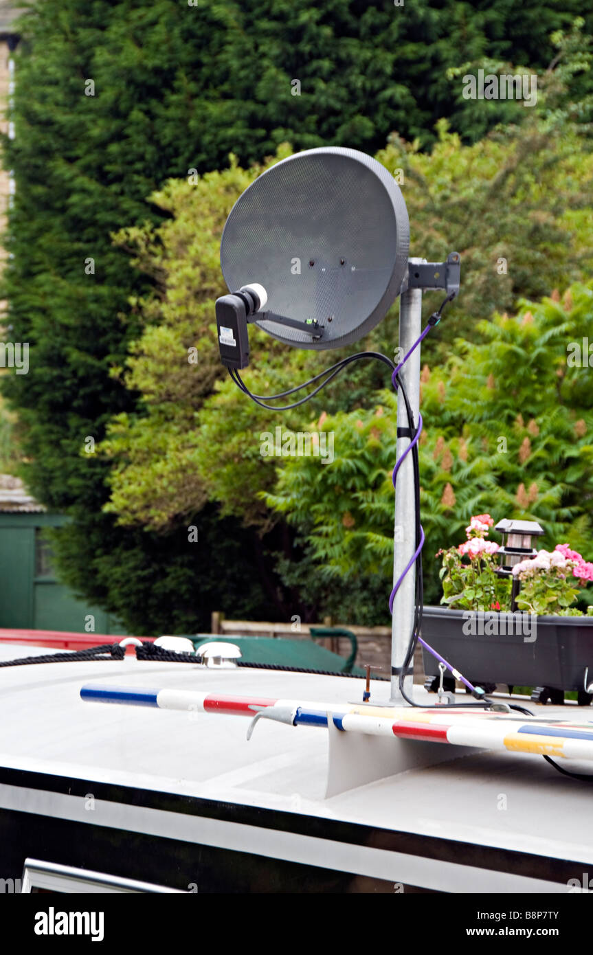 Satelite dish atop a narrowboat UK Stock Photo