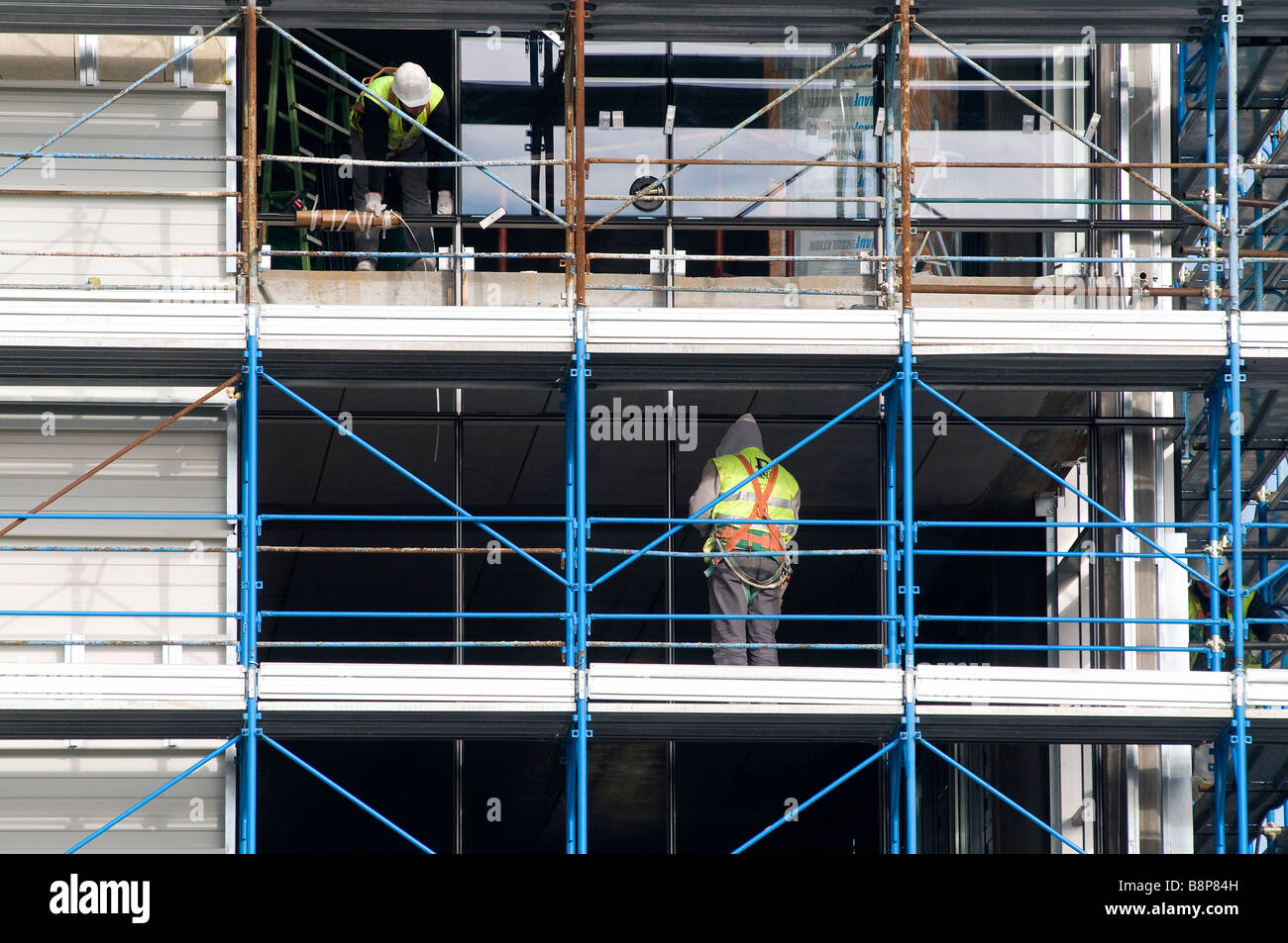 some workers on a construction site for the construction of a building Stock Photo