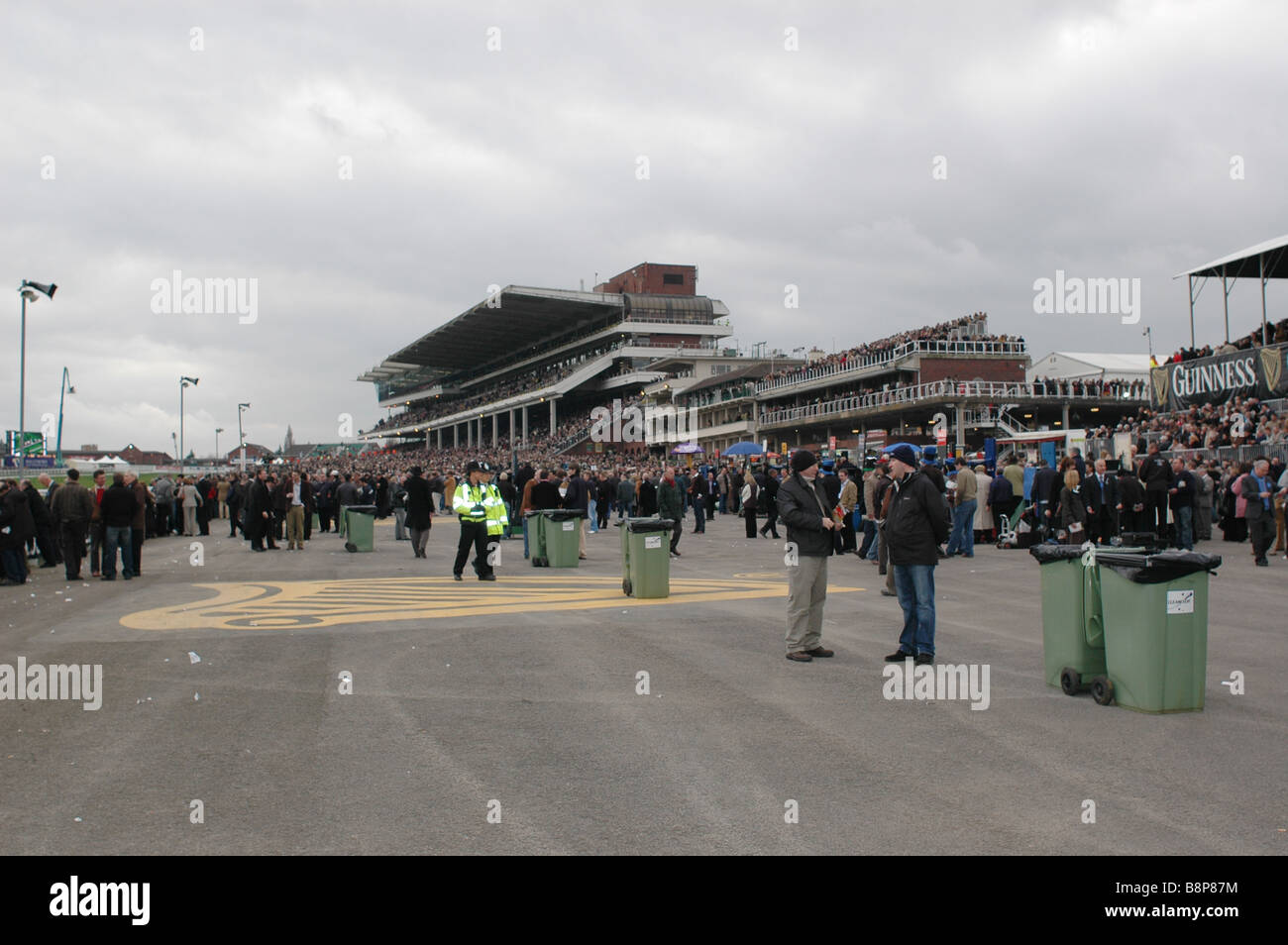 Fans at the Cheltenham Gold Cup Races amongst the Racecourse Stadium Stock Photo