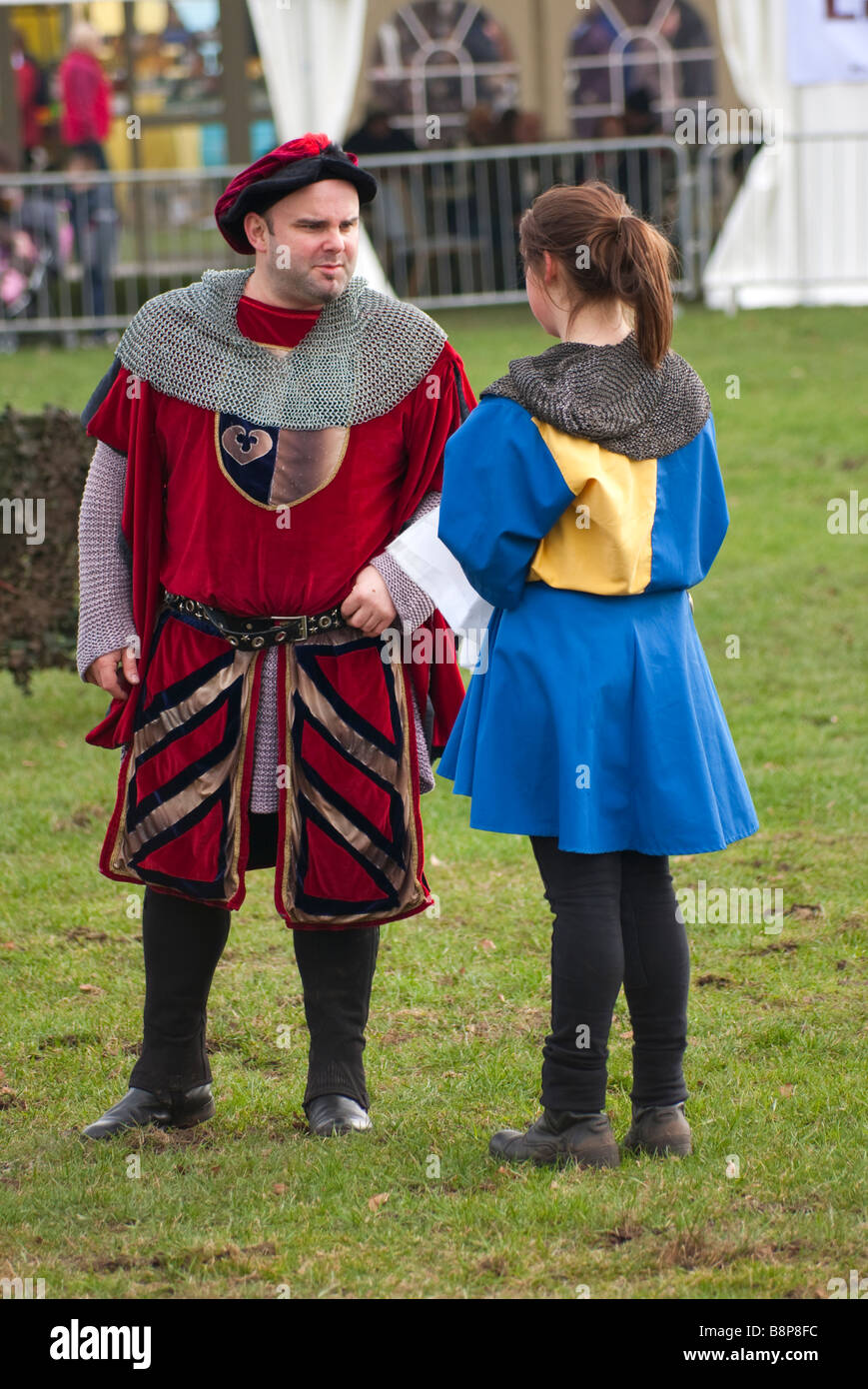 two people dressed in medieval costume at a public display Stock Photo ...