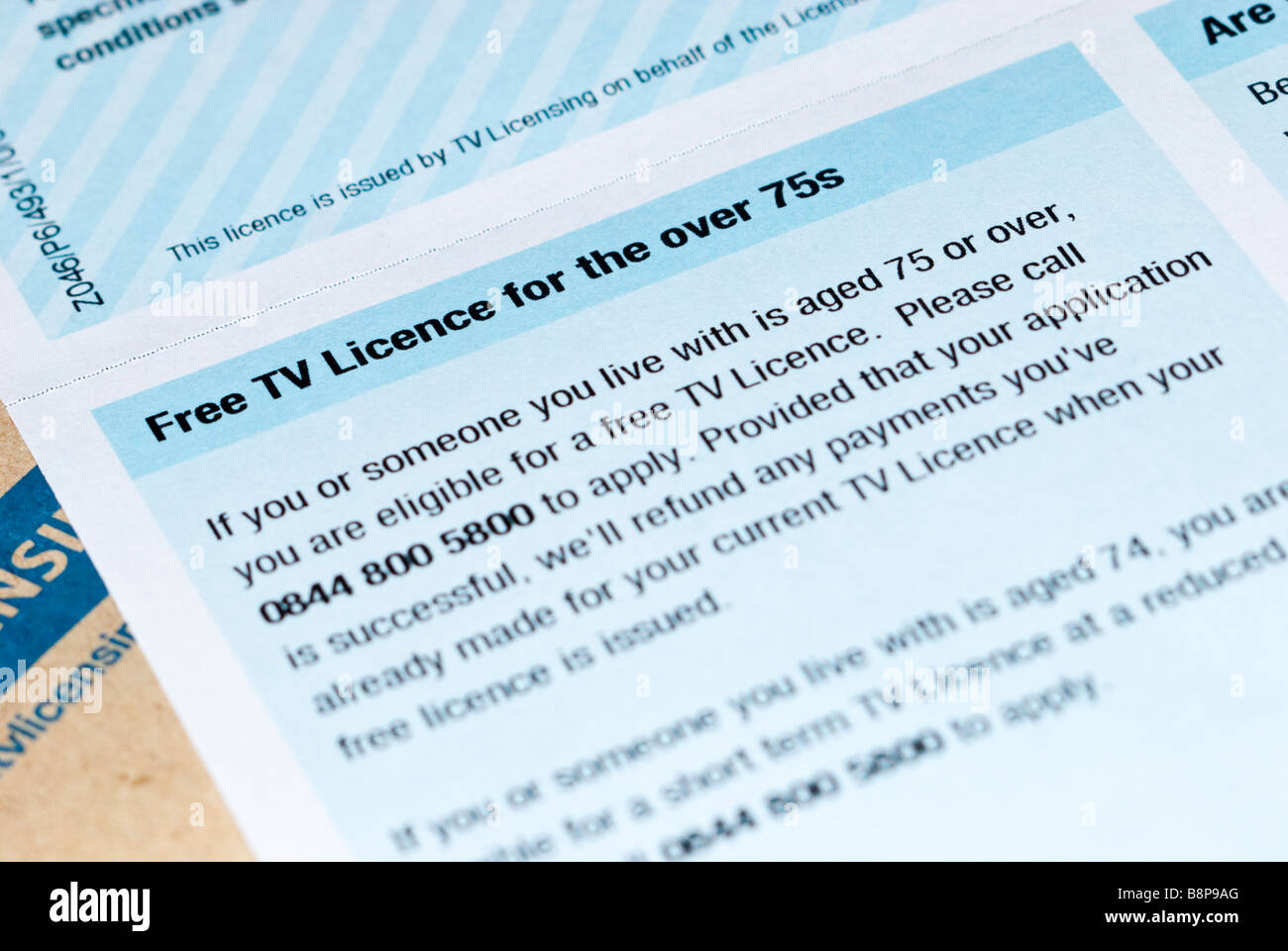 A close up of a uk tv television licence stating FREE TV licence for the over 75's Stock Photo