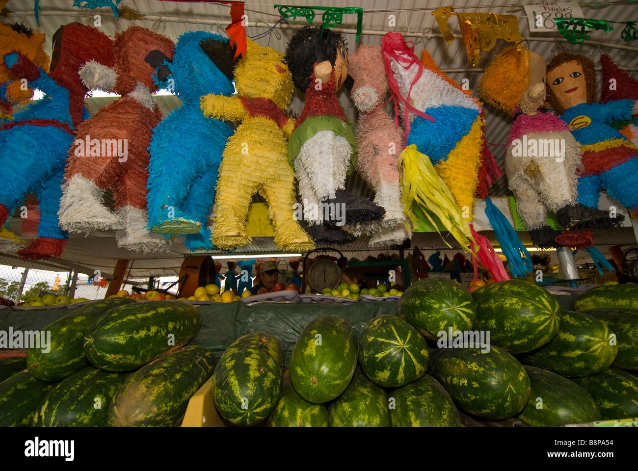 Outdoor market watermelons pinatas hanging from ceiling San Antonio texas tx Stock Photo