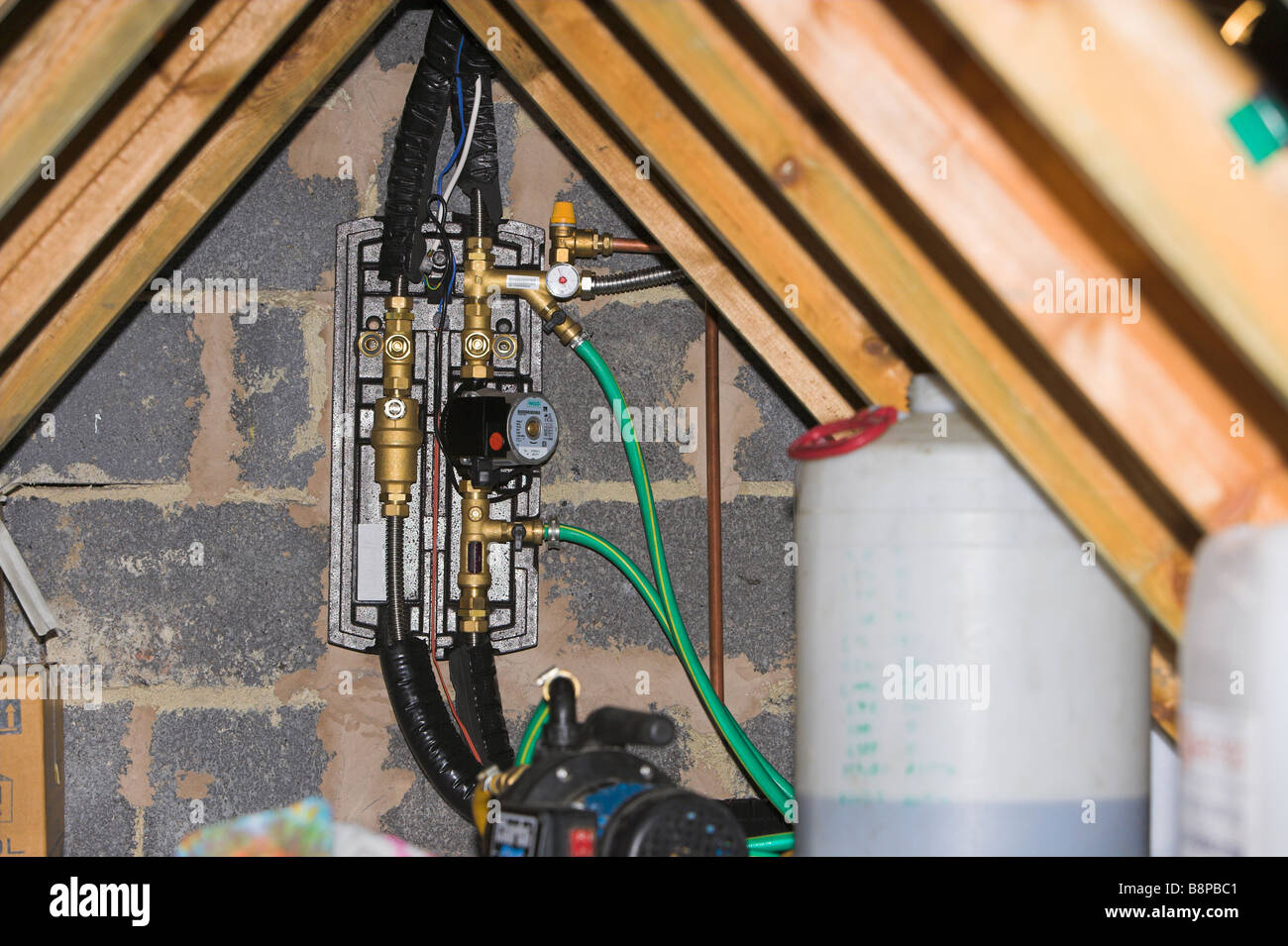 Solar heating control unit installed in loft Stock Photo Alamy