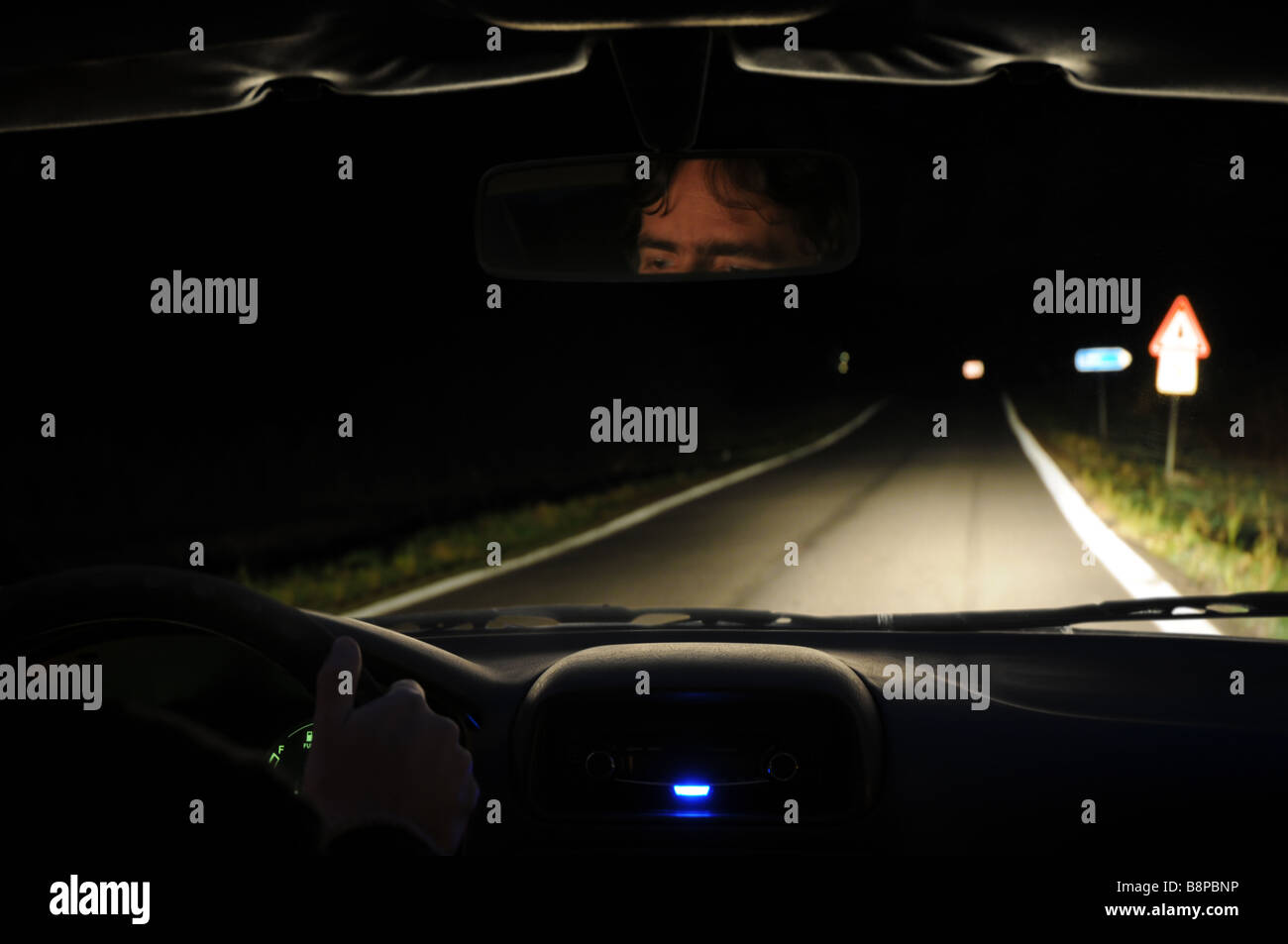 Driving in the night - view from the cabin of a car. Stock Photo