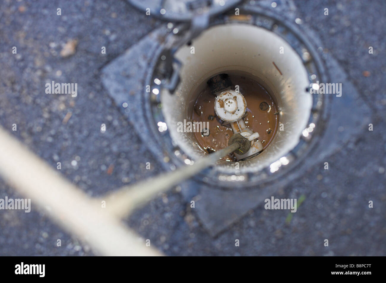 water-supply-stop-cock-in-footpath-with-t-bar-stock-photo-22620188-alamy