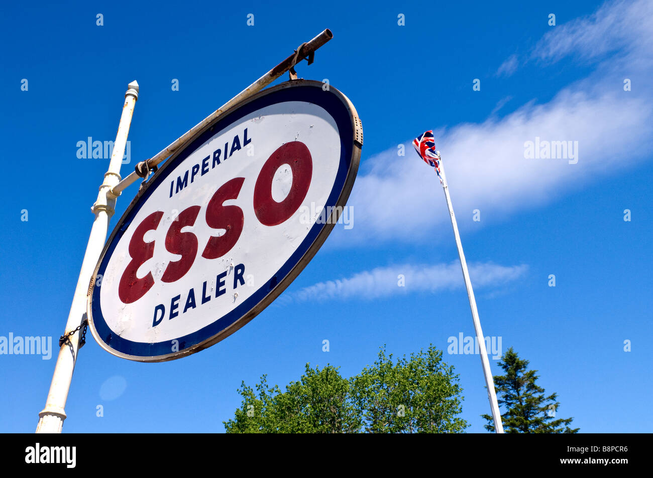 Imperial Oil Esso gas station dealer sign and UK flag Stock Photo