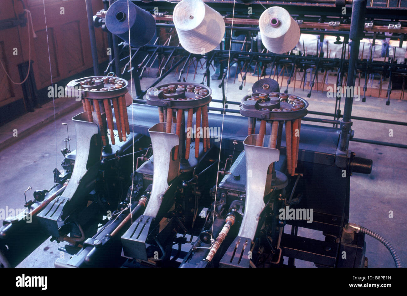 Spools and fabric in an industrial clothing factory from the early 20th