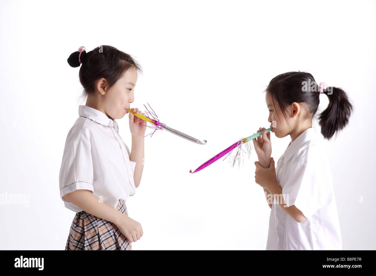Girls with Party Horn Blower portrait Stock Photo - Alamy