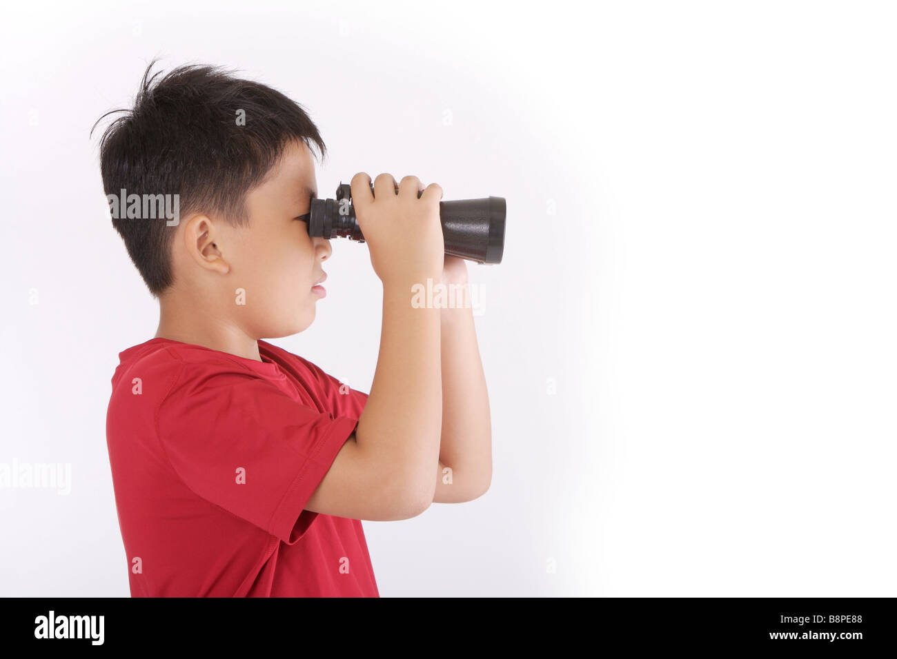 Boy looking with telescope side view portrait Stock Photo - Alamy