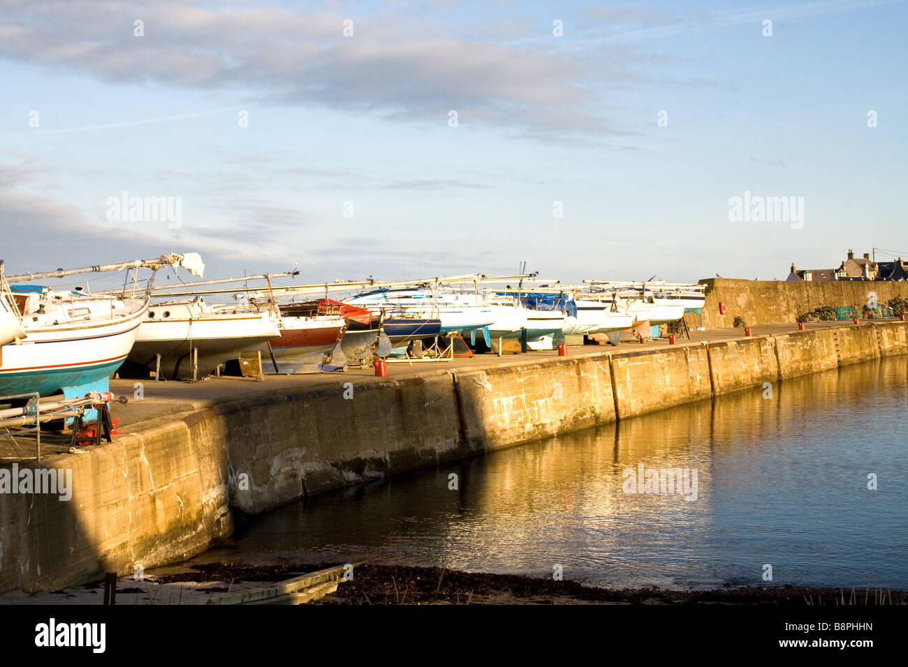 Row of boats on the pier, Findochty Harbour, Scotland Stock Photo