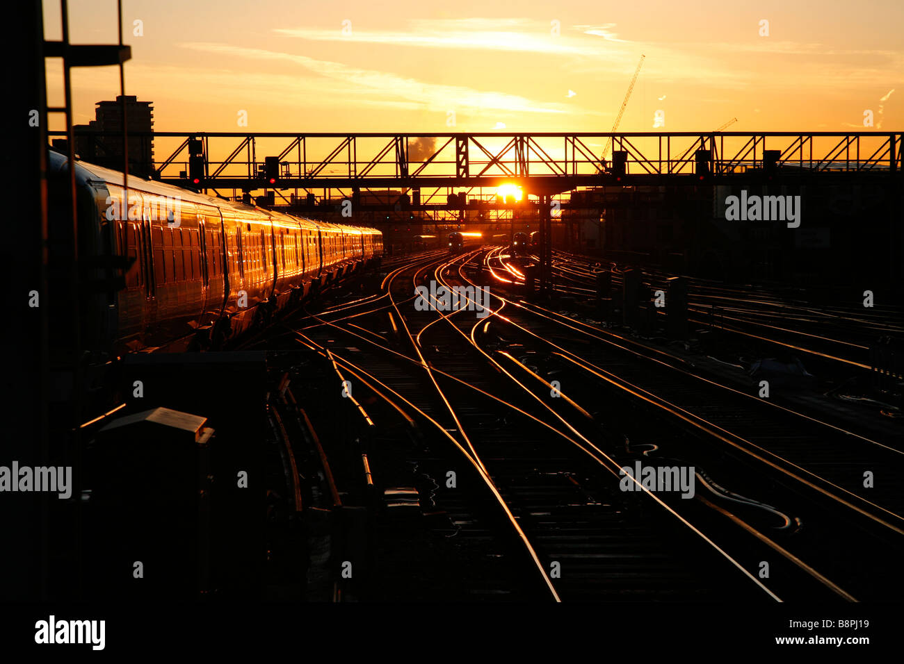 Trains coming in and out of London Bridge station, London, at sunrise Stock Photo