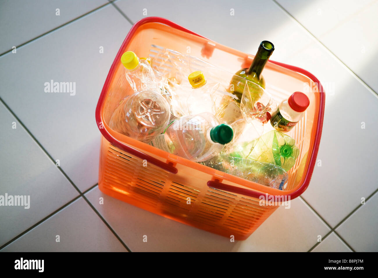 Recycling bin filled with plastic and glass bottles Stock Photo - Alamy