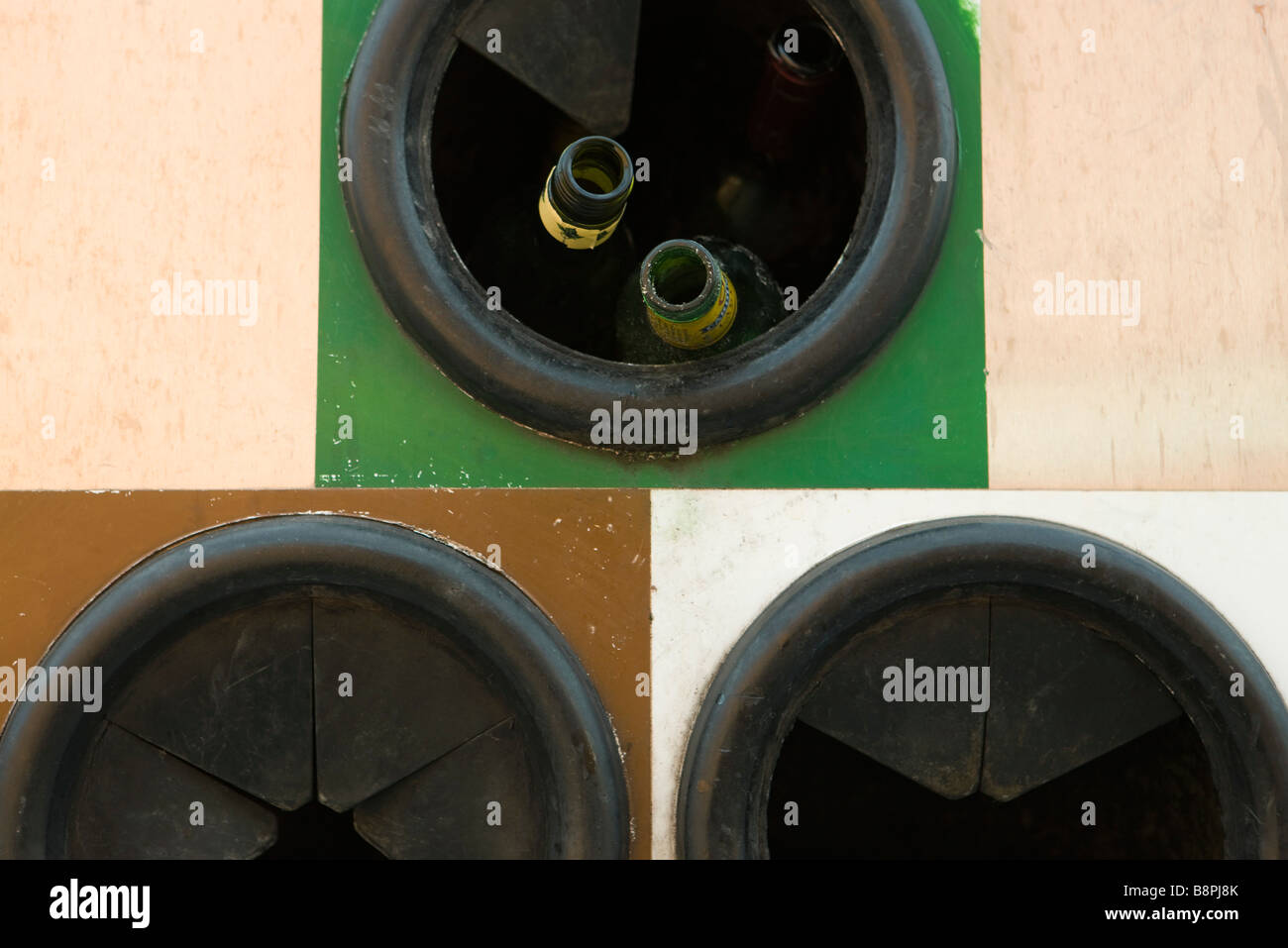 Glass bottles in recycling bin, extreme close-up Stock Photo - Alamy
