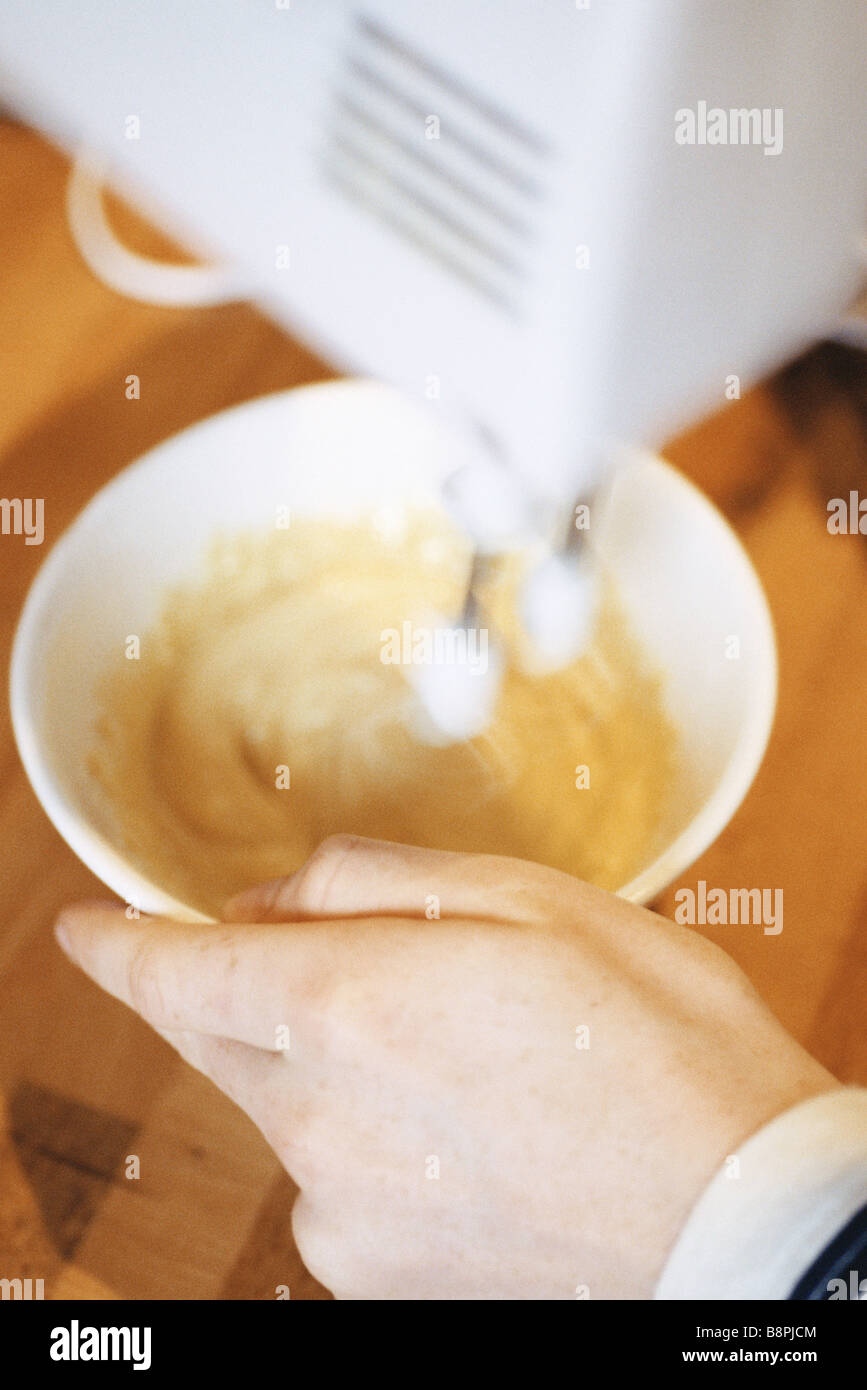 Mixing batter with electric mixer Stock Photo Alamy