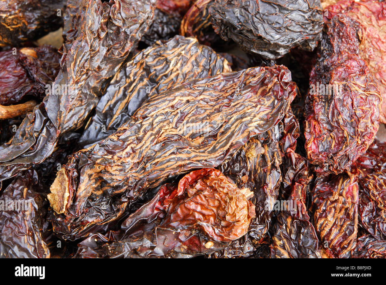 Chipotles. Dried, smoked jalapeno chillies used to add a smoky heat to Mexican and TexMex dishes. Stock Photo